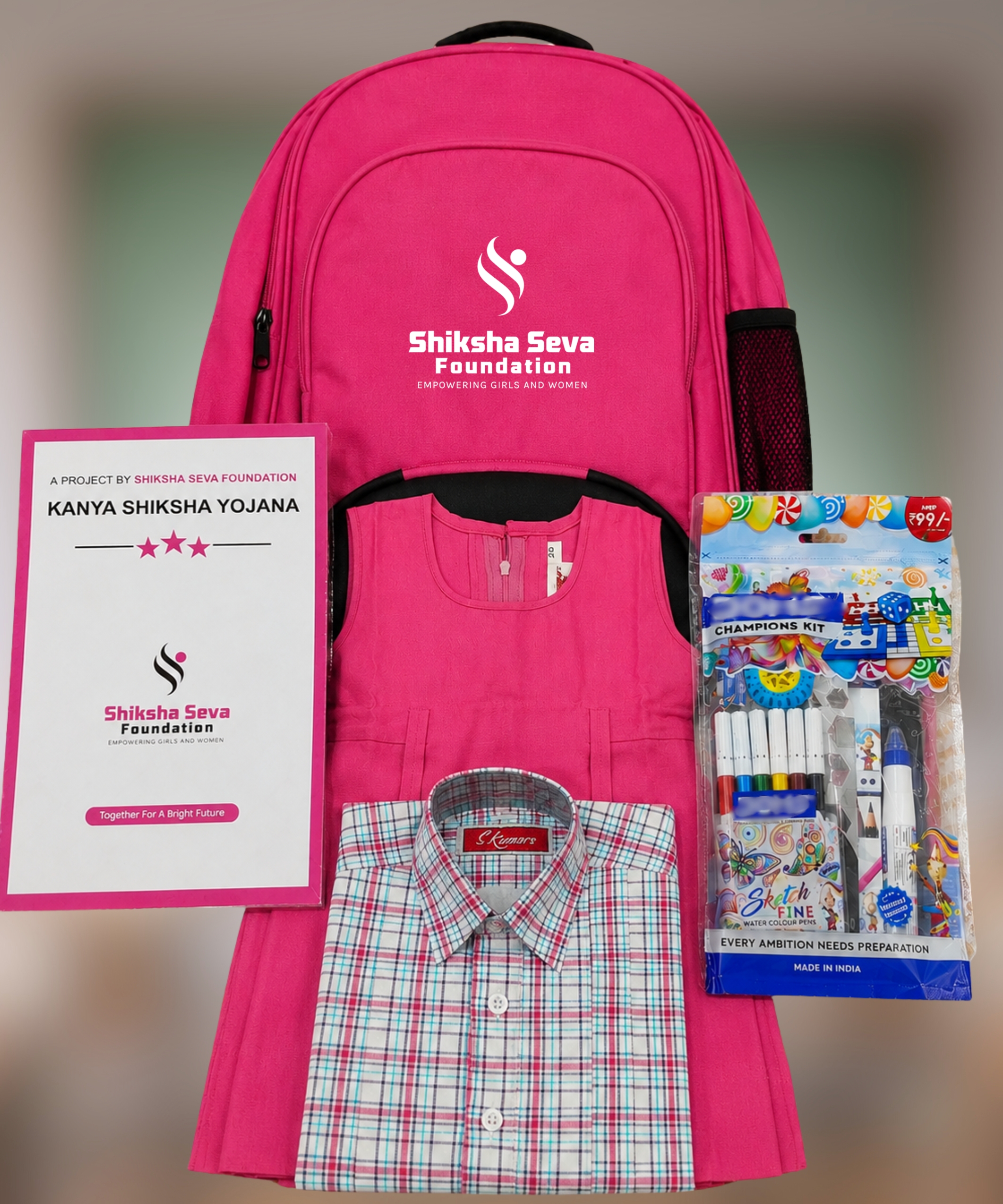 Child holding notebooks and stationery from the Educational Kit